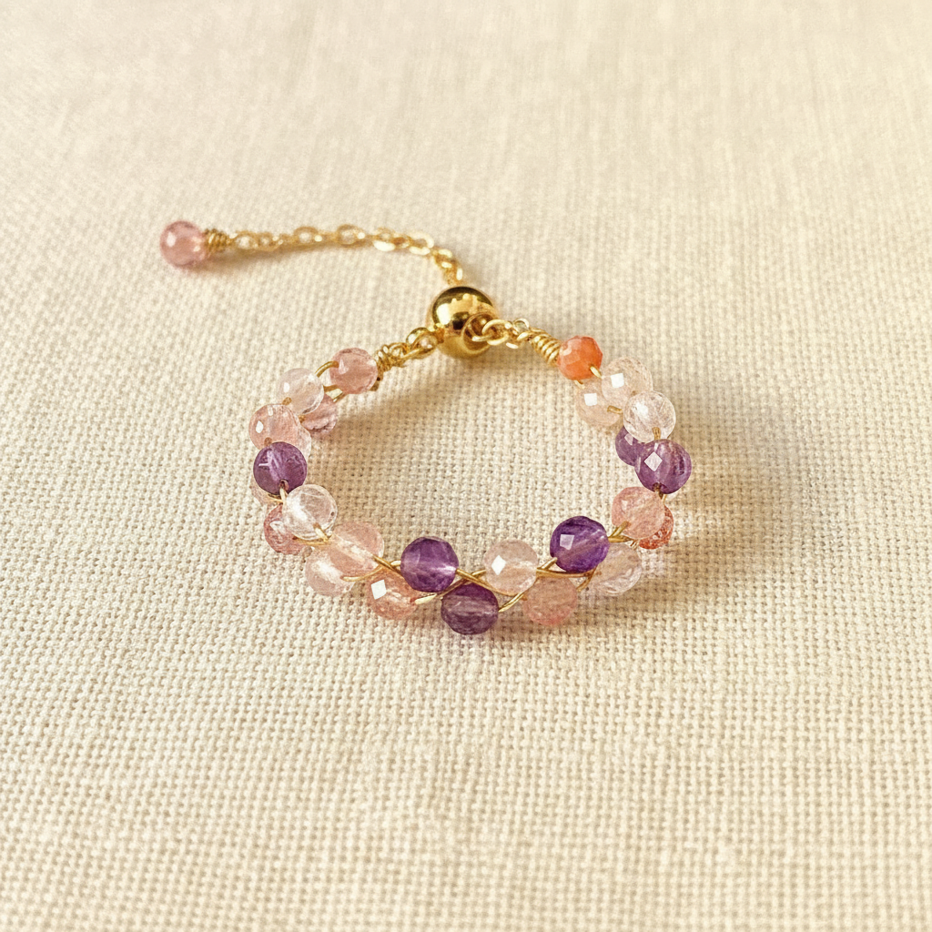 Strawberry Quartz & Amethyst Ring — main product image on cream linen