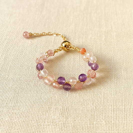 Strawberry Quartz & Amethyst Ring — main product image on cream linen