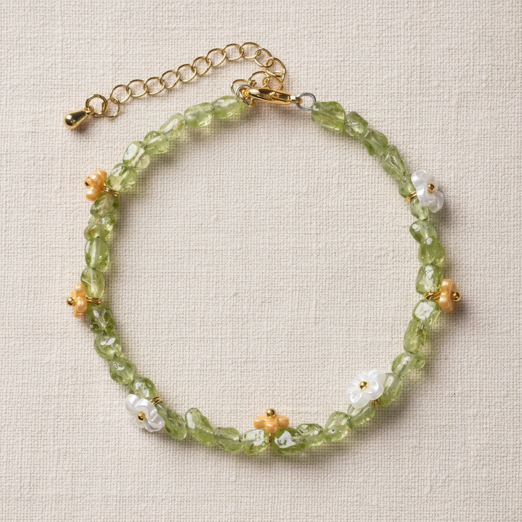 Peridot bracelet full circle flat lay on warm cream linen