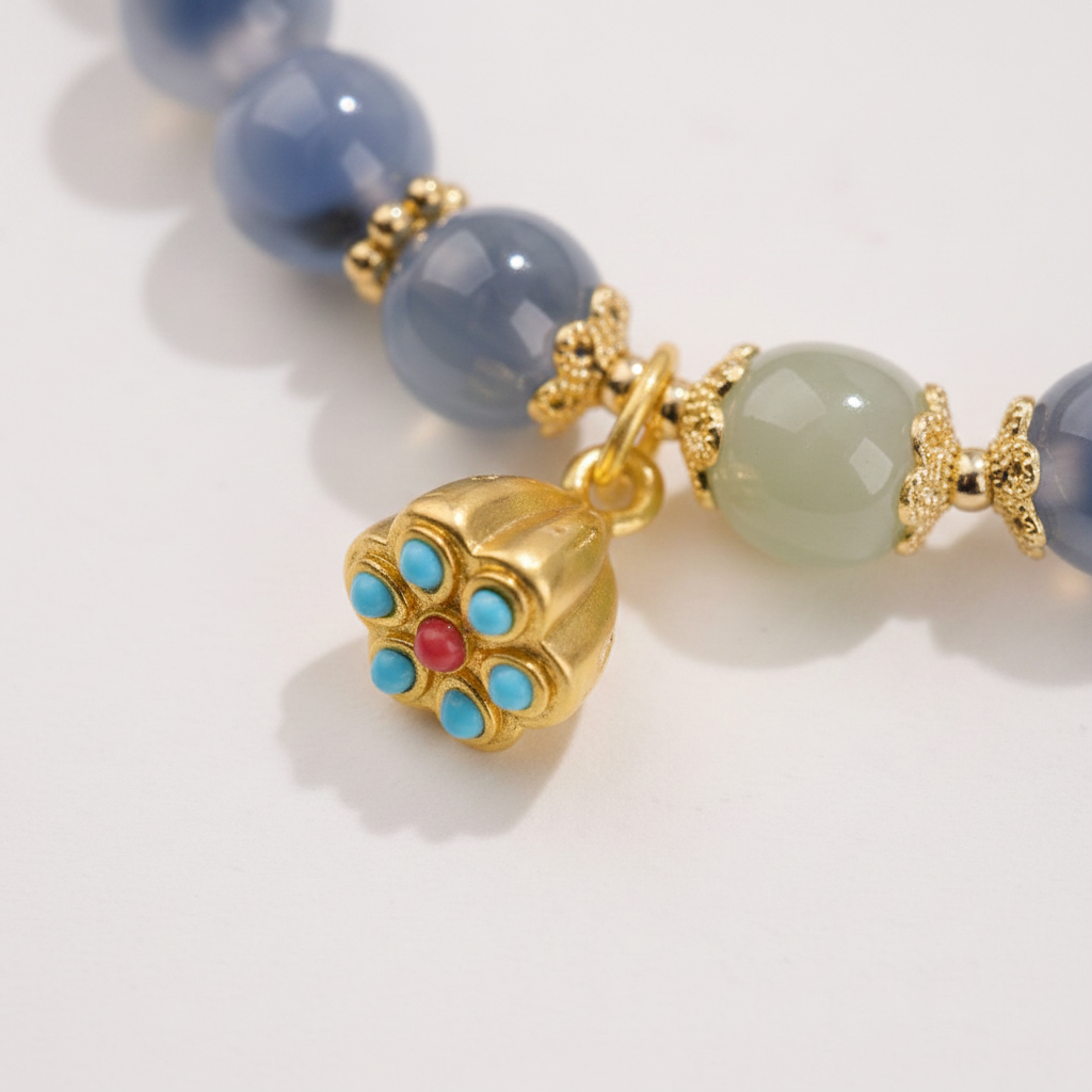 Gold enamel pendant charm close-up detail