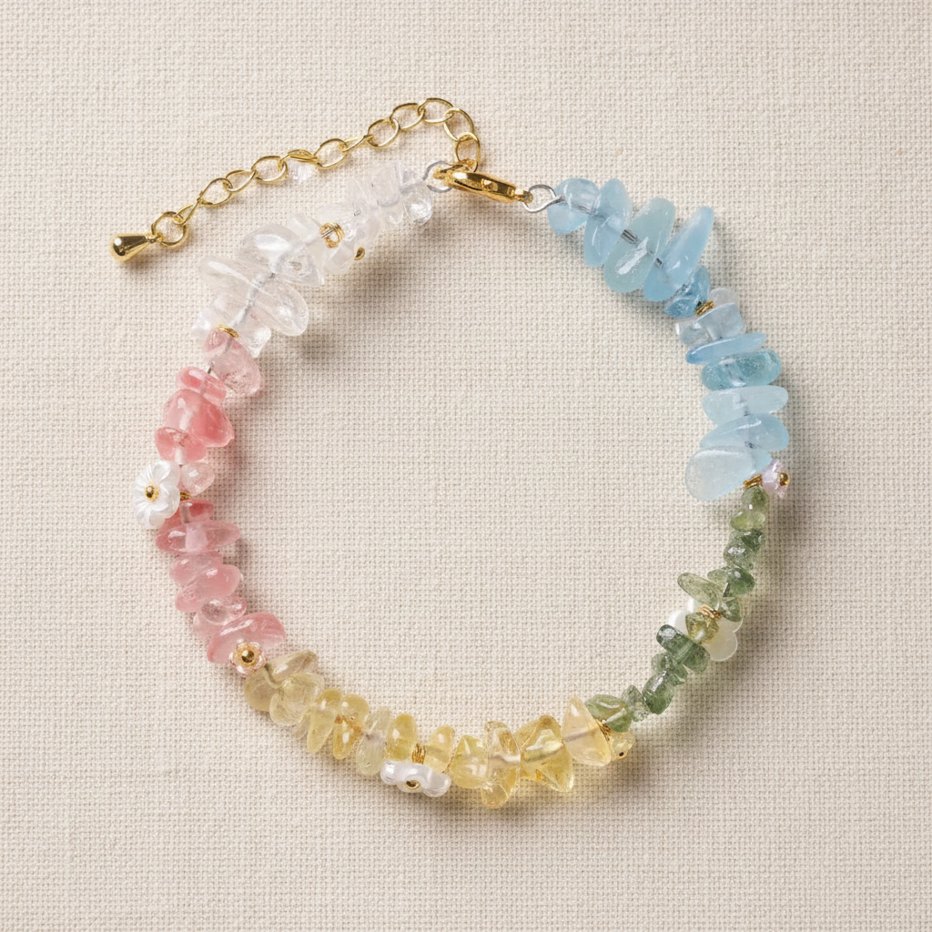 Rainbow crystal bracelet full circle flat lay on warm cream linen