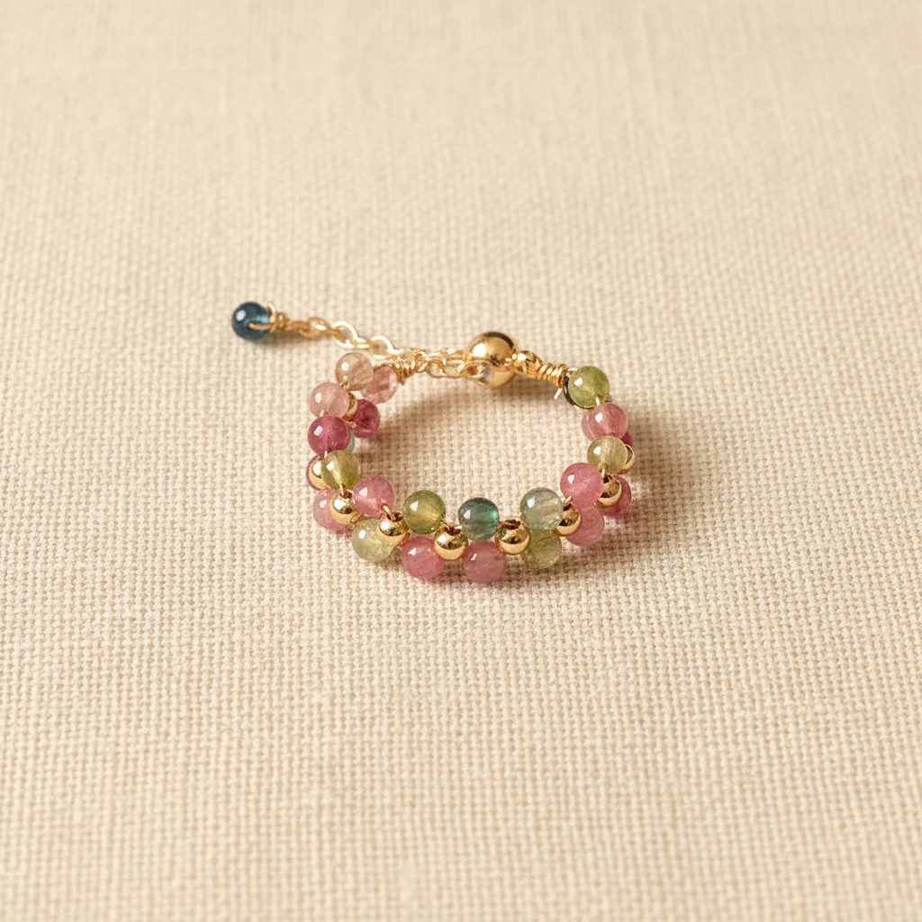 Multicolor Tourmaline Wire-Wrapped Ring — main product image on cream linen