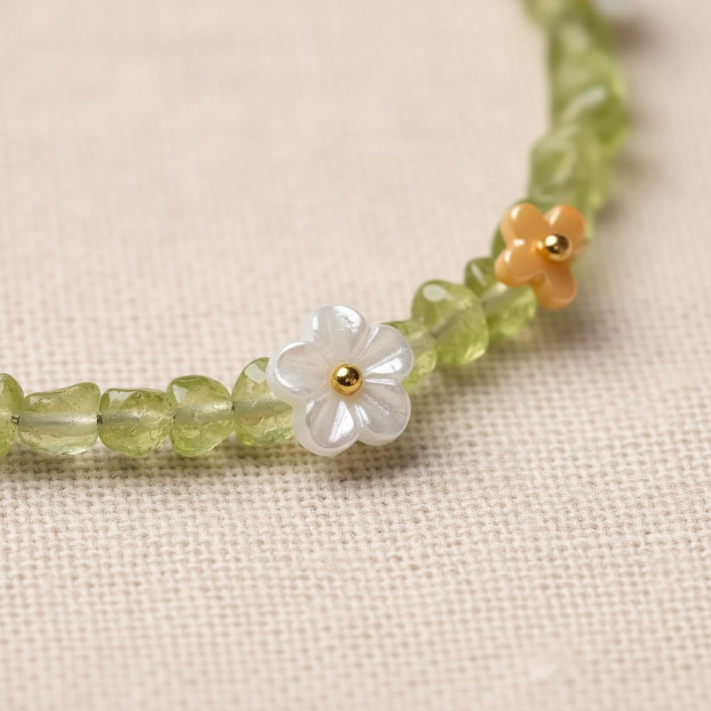 Carved white shell and golden flower charm close-up
