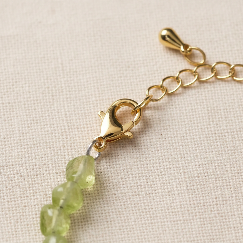 Gold lobster clasp and extension chain close-up
