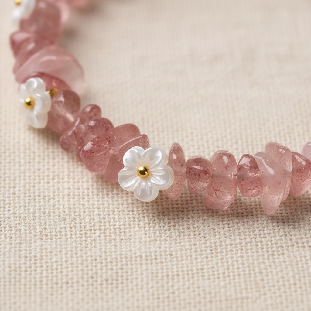 White shell daisy flower charms with gold ring connectors close-up