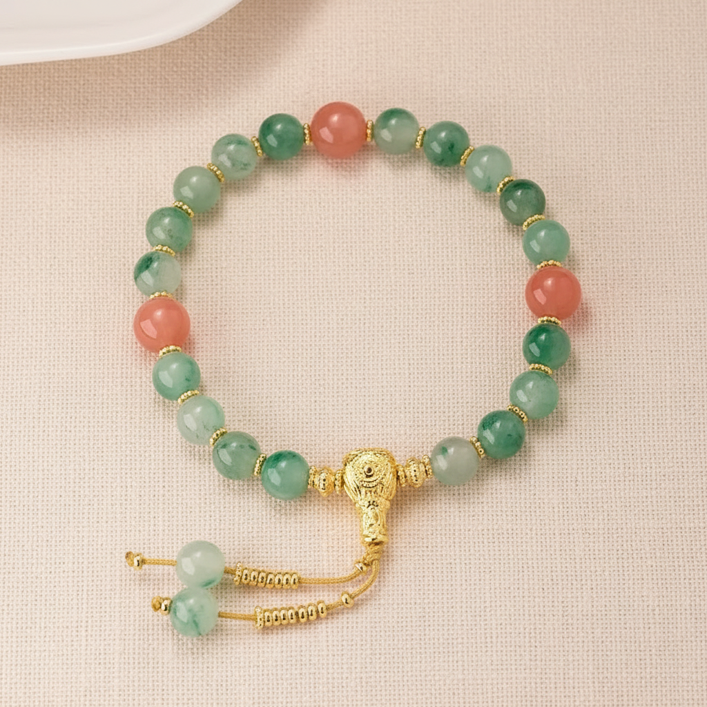 Green aventurine bracelet full circle flat lay on warm cream linen