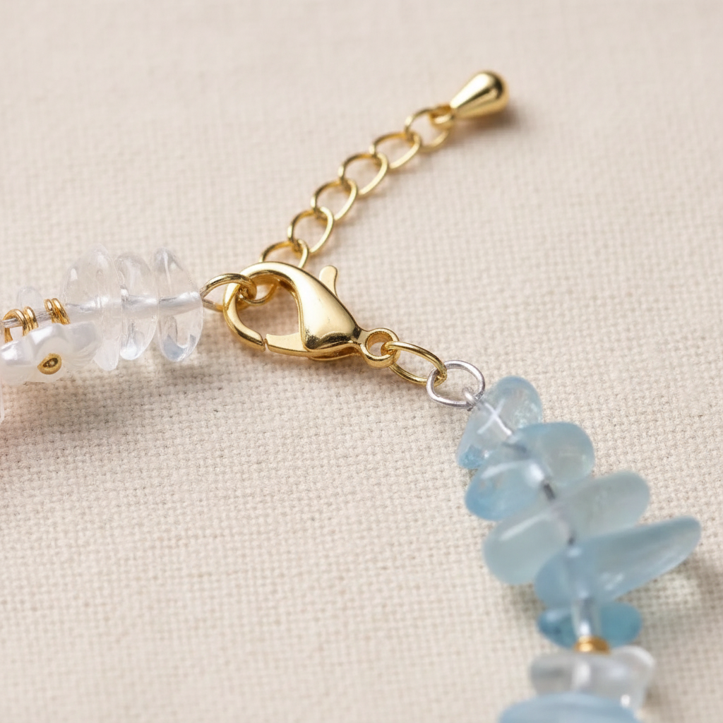 Gold lobster clasp and extension chain close-up