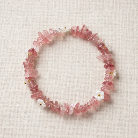 Strawberry quartz bracelet full circle flat lay on warm cream linen