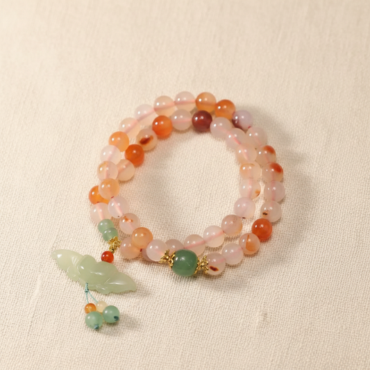 Carnelian agate bracelet full circle flat lay on warm cream linen
