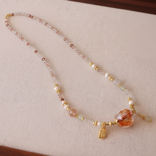 Crystal Pearl & Lampwork Flower Necklace — main product image on cream linen