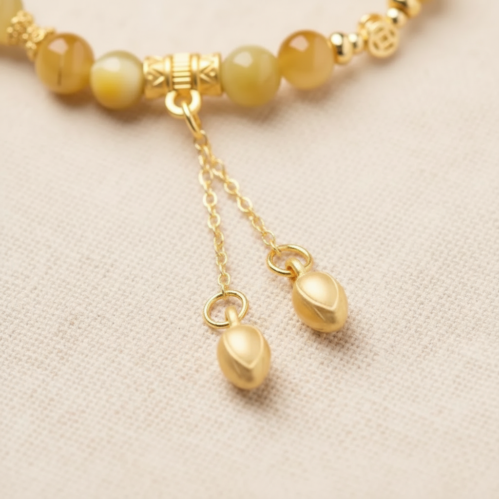 Gold chain tassel drops detail