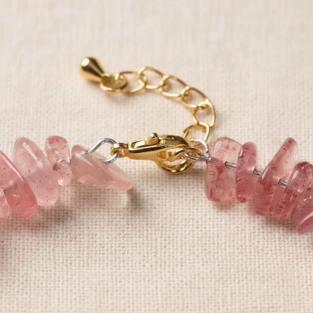 Gold lobster clasp and extension chain close-up