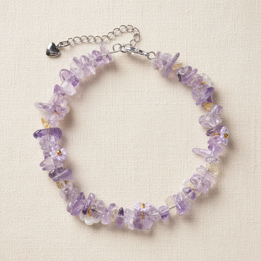 Amethyst bracelet full circle flat lay on warm cream linen