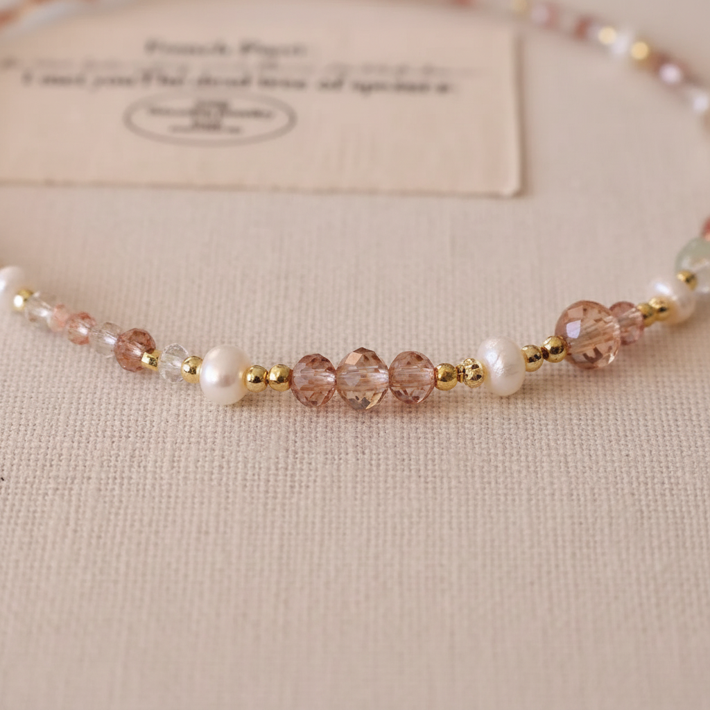 Pink-brown zircon crystal bead close-up detail